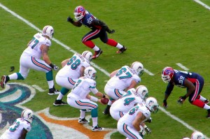 Bills Defenders rushing the Miami Dolphins pass protection